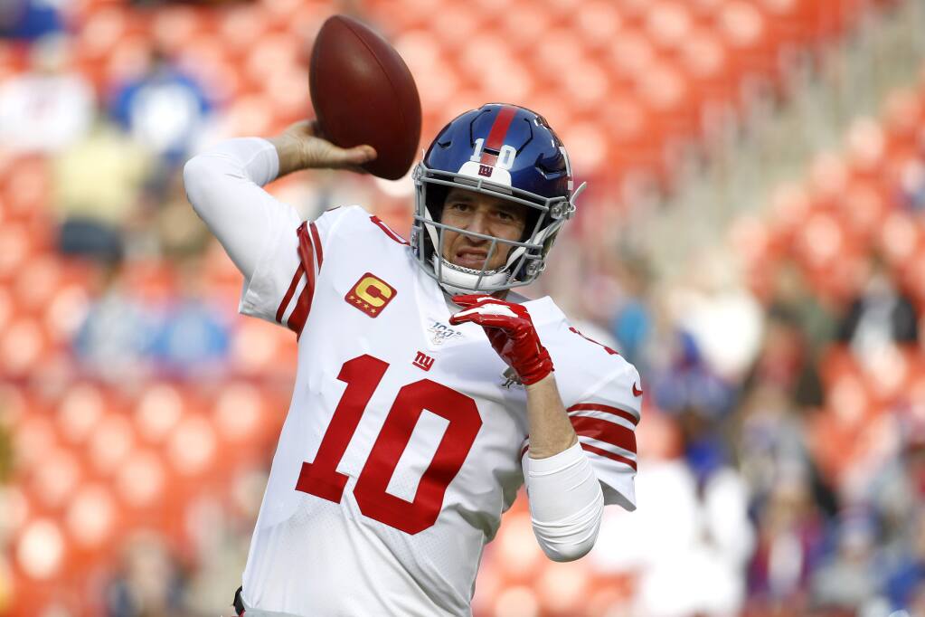 NFL ROUNDUP: Eli Manning lifts Giants to wild win over Bucs