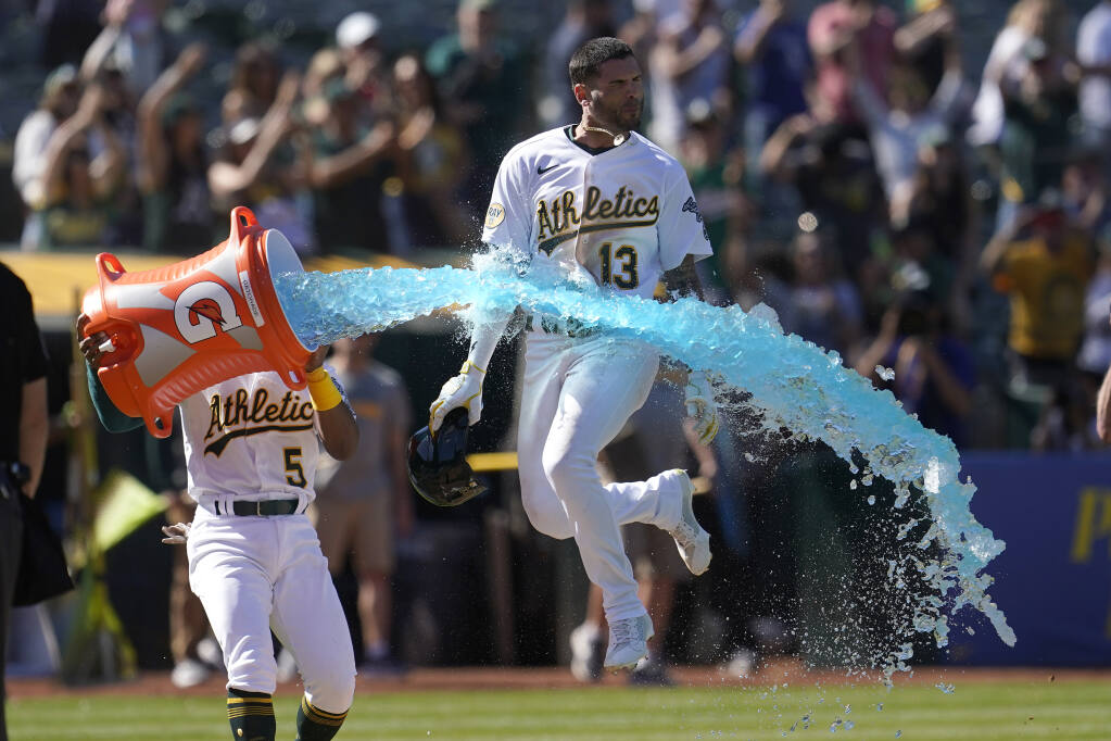 A's split doubleheader with Angels
