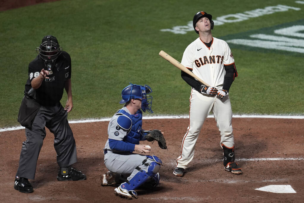 Giants catchers work on the back pick, a favorite Buster Posey play