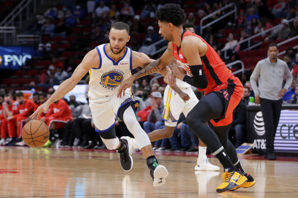 Stephen Curry heats up late to lead Warriors over Rockets 122-108