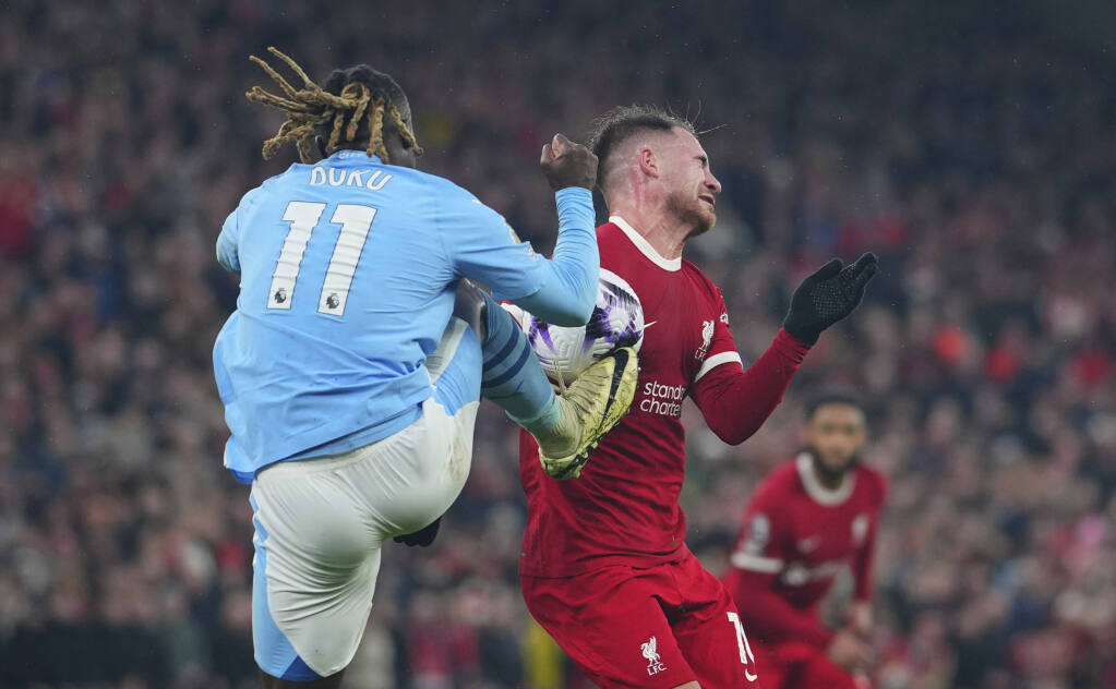 Soccer: Liverpool denied late penalty in thrilling 1-1 draw with Manchester  City