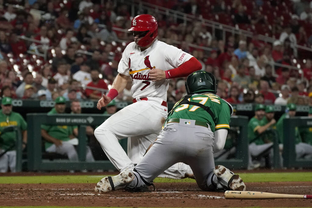 St. Louis Cardinals' Andrew Knizner hits a two-run single during