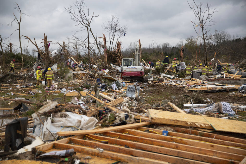 Six dead after tornadoes destroy  warehouse near St Louis