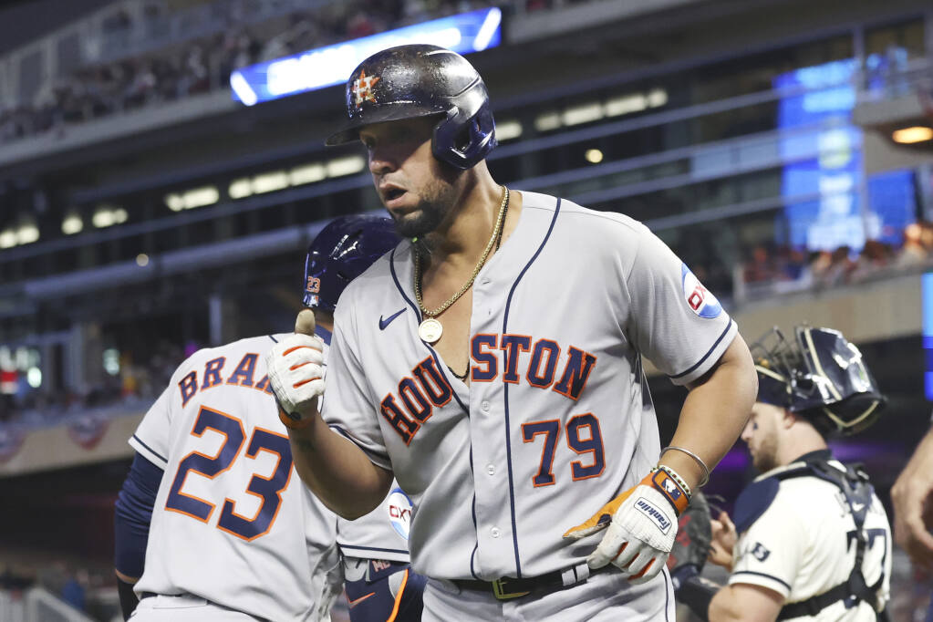 Altuve, Javier lead Astros to 8-5 win at Rangers as Houston closes
