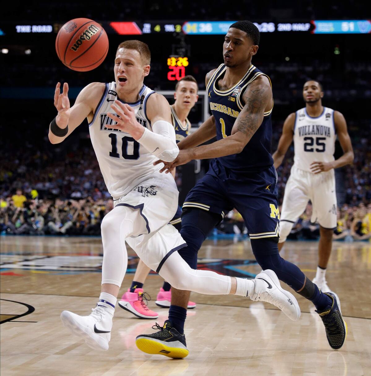 Villanova's Jalen Brunson, left, celebrates with Donte DiVincenzo after the  team's NCAA college basketball game against Providence in the Big East  men's tournament final Saturday, March 10, 2018, …