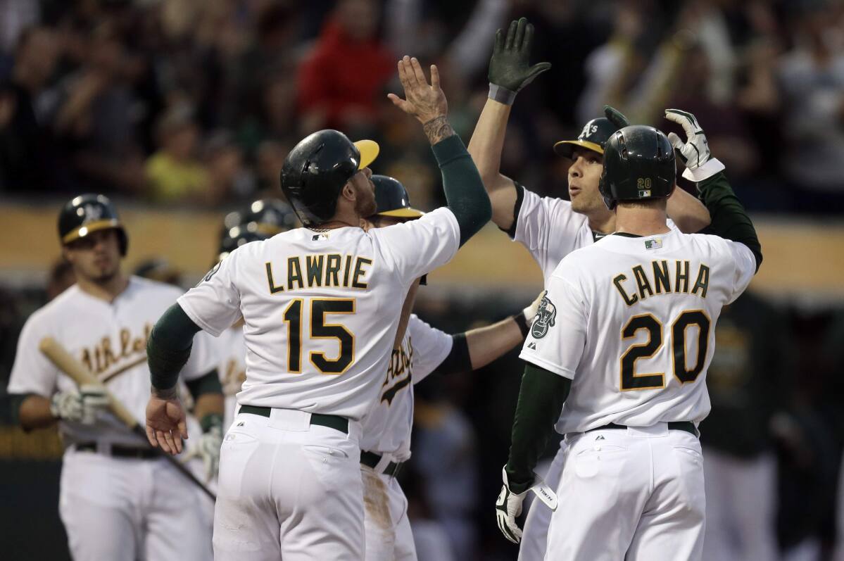 Grand slam not enough for A's in 11-8 loss to Seattle
