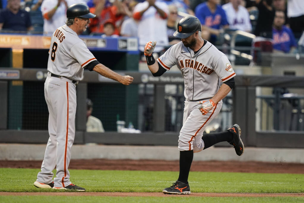 The San Francisco Giants' Brandon Belt reacts after striking out