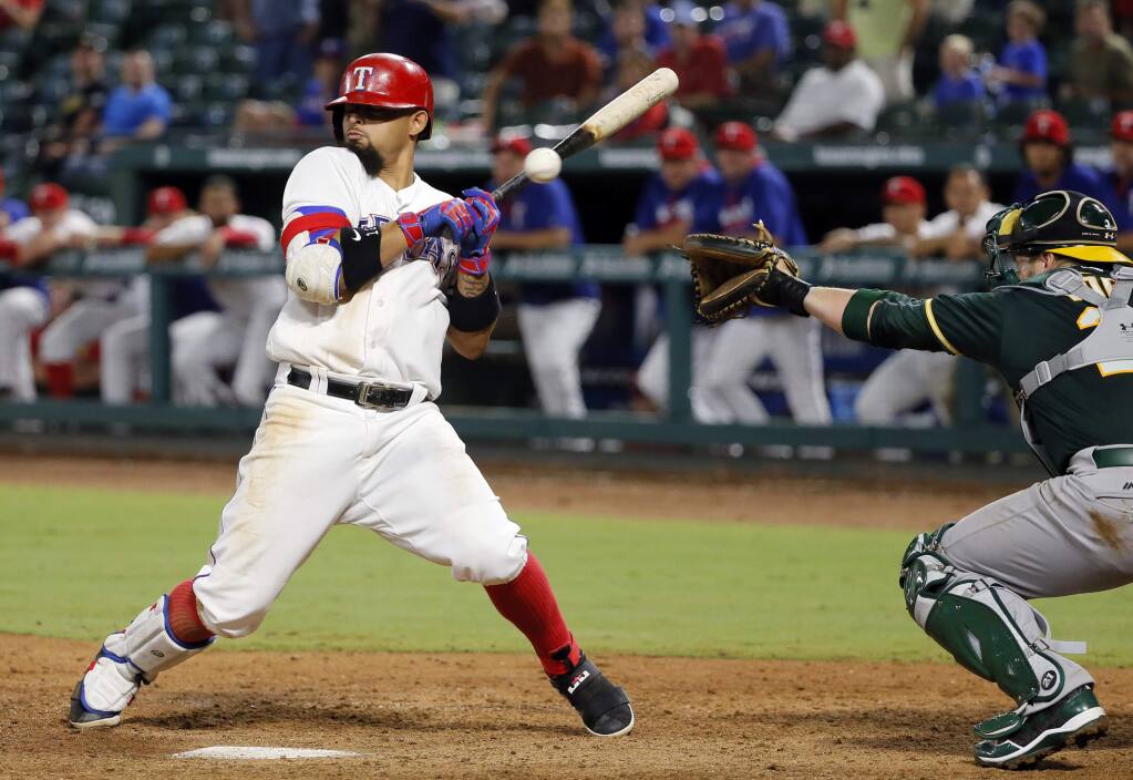 Rangers rally in 9th again to beat A's 8-5 for 3rd in row
