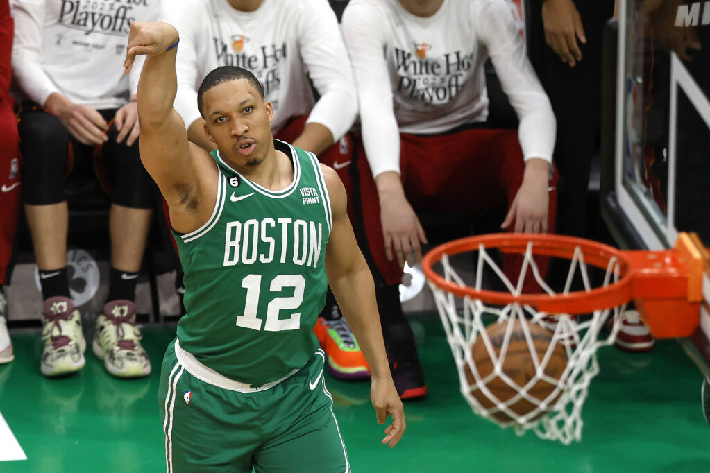 Miami Heat forward Caleb Martin (16) shoot against Boston Celtics