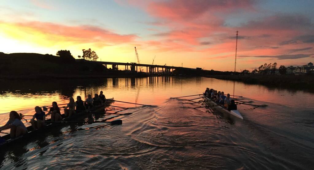 rowing team sunset