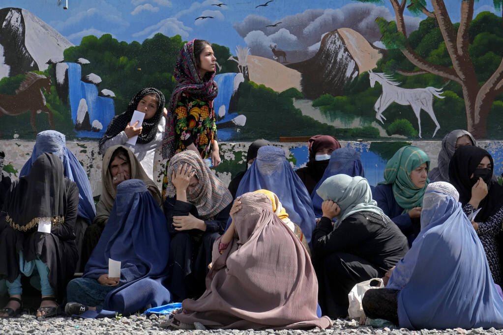 Afghanistan's Taliban order women to cover up head to toe