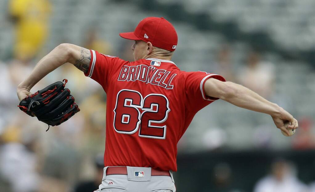 Angels set tone early, hold on to beat White Sox