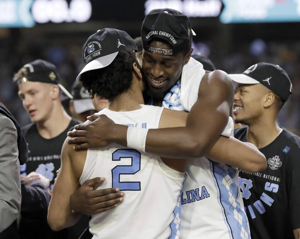 North Carolina's Theo Pinson (1) and the rest of the team celebrate after  the finals of the Final Four NCAA college basketball tournament against  Gonzaga, Monday, April 3, 2017, in Glendale, Ariz. …