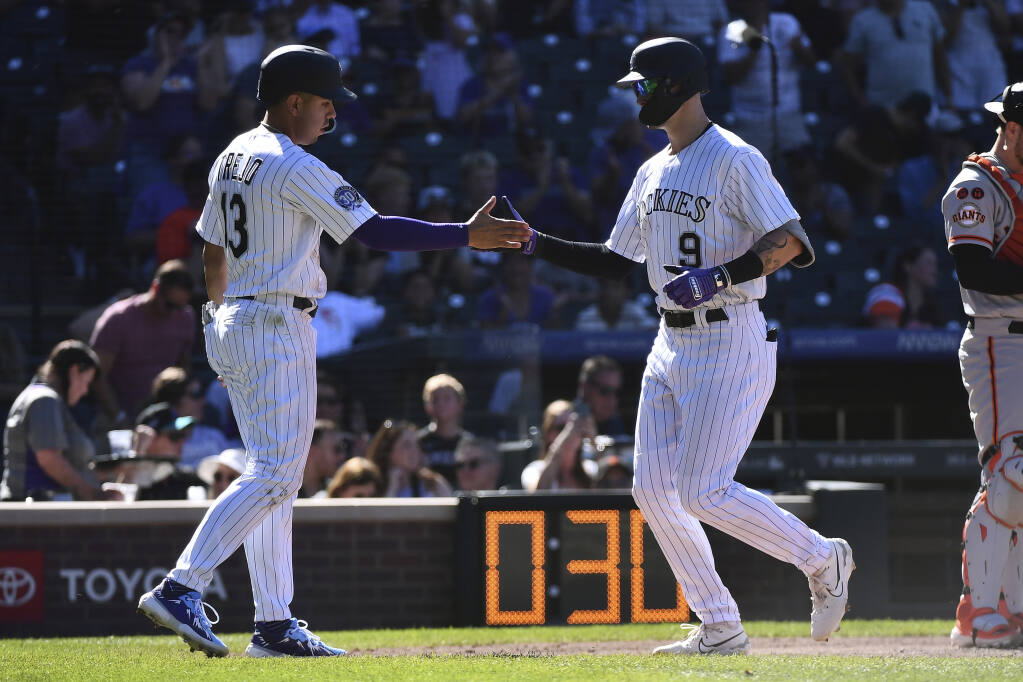 Giants open 9-run lead, hang to to beat Rockies 11-10 and stop slide - The  San Diego Union-Tribune