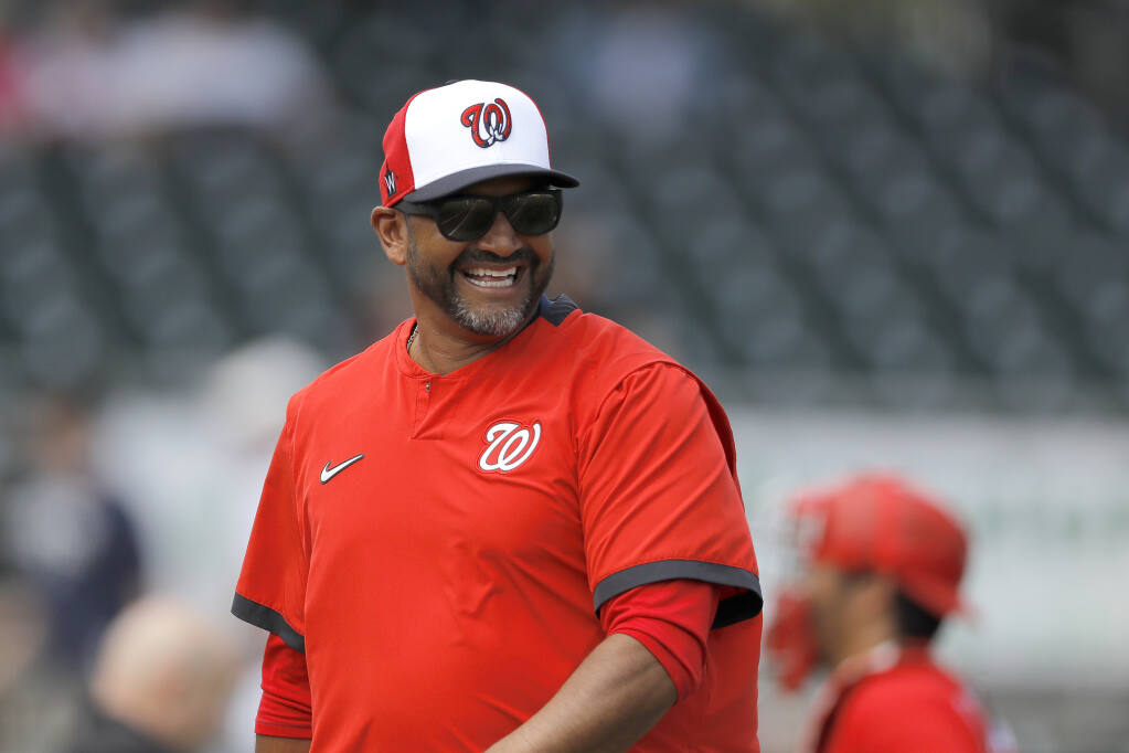 Washington Nationals manager Dave Martinez walks to the dugout