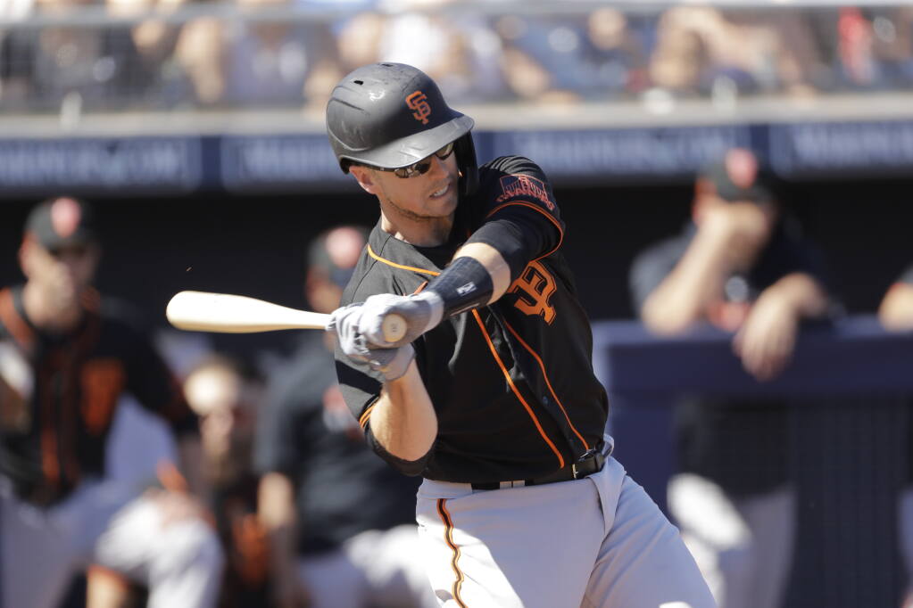 Giants' Buster Posey works out arm in offseason firing dirty diapers