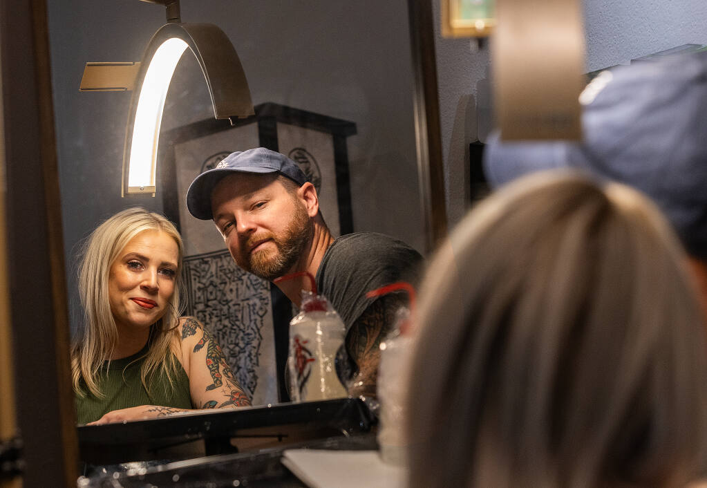 Evan Wilson, right, and his wife, Isabel Solomon, recently opened Redtail Tattoo Gallery and Studio in Cotati. Photo taken Friday, July 28, 2023. (John Burgess/The Press Democrat)
