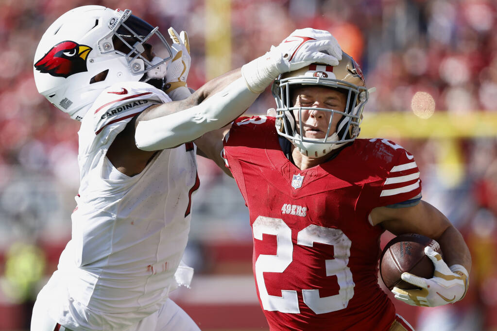 Christian McCaffrey scores 4 TDs to lead the 49ers past the Cardinals 35-16