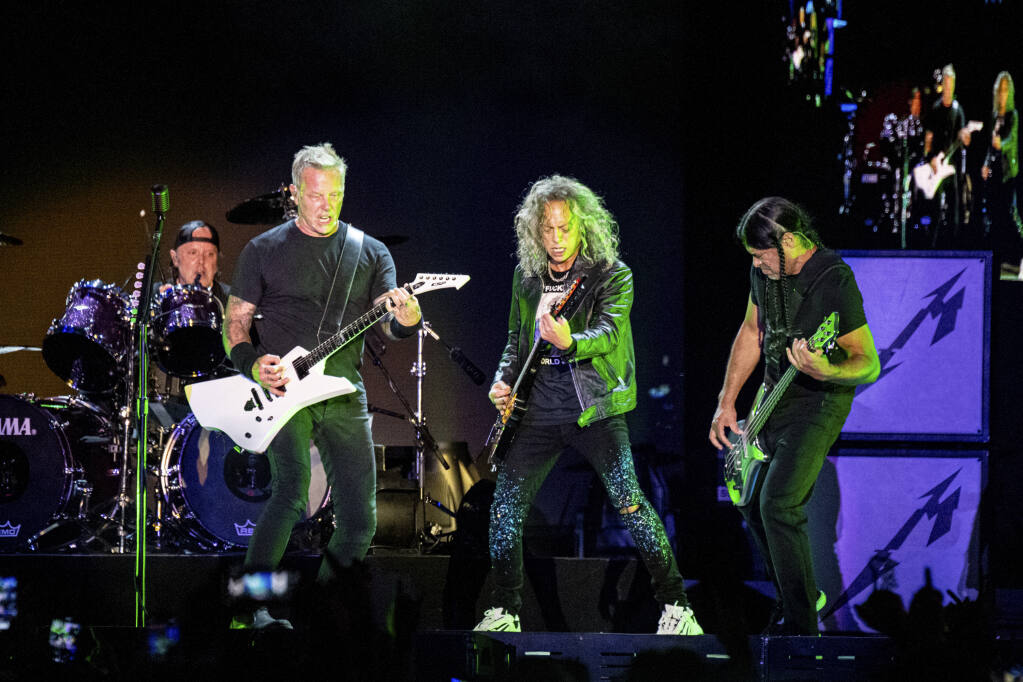 Lars Ulrich, left, James Hetfield, Kirk Hammett and Robert Trujillo of Metallica perform at Louder Than Life Festival 2021 at Highland Festival Grounds on Friday, Sept. 24, 2021, in Louisville, Kentucky. Metallica will headline the BottleRock Napa Valley 2022 festival in Napa in May. (Amy Harris/Invision/Associated Press)