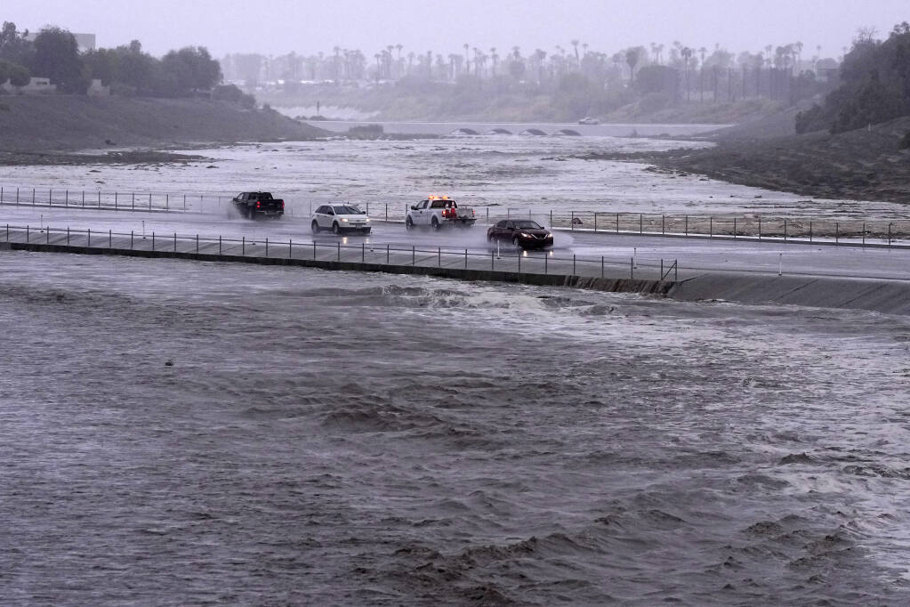 Rain from Tropical Storm Hilary lashes California and Mexico, swamping  roads and trapping cars