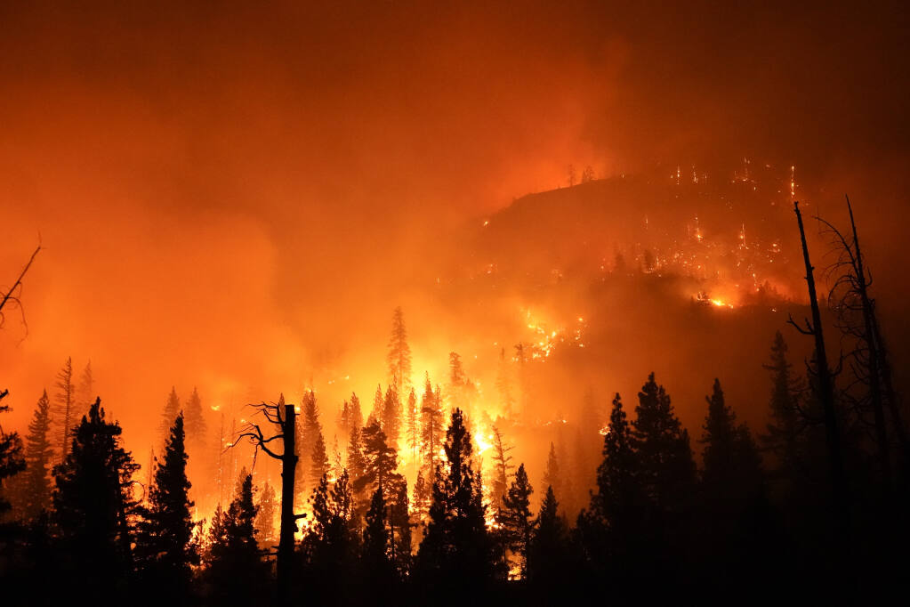 The Creek fire burns in the Sierra National Forest, Sunday, Sept. 6, 2020, near Big Creek, Calif. (AP Photo/Marcio Jose Sanchez)