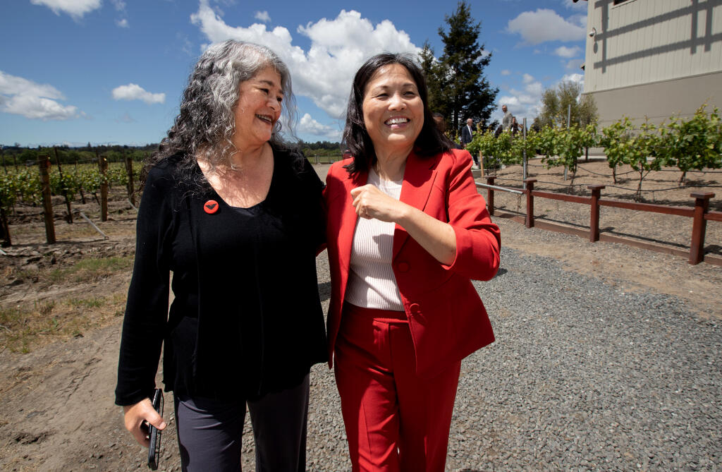 Acting U.S. Secretary of Labor Julie Su, right, walks with Teresa Romero, president of United Farm Workers, after a press conference where Su announced a new labor department rule to ensure fair labor standards for the U.S. agricultural industry, at Balletto Vineyards in Santa Rosa, Friday, April 26, 2024. (Darryl Bush / For The Press Democrat)