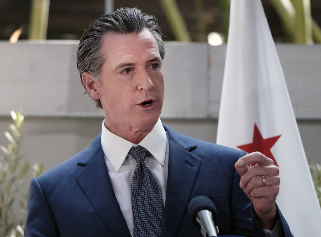 FILE - California Gov. Gavin Newsom answers questions at a news conference in Los Angeles, on June 9, 2022. Newsom  on Wednesday called on Hollywood to “walk the walk” on liberal values by bringing back their film and television productions from states such as Georgia and Oklahoma.  (AP Photo/Richard Vogel, File)