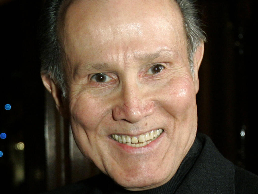 FILE - Actor Henry Silva is photographed during fellow actor Ernest Borgnine's 90th birthday party at a restaurant in Los Angeles, on Jan. 24, 2007. Silva, a prolific character actor best known for playing villains and tough guys in “The Manchurian Candidate,” “Ocean's Eleven” and other films, has died at age 95. Silva's son Scott Silva told Variety that he died Wednesday, Sept. 14, 2022, of natural causes at the Motion Picture and Television Country House and Hospital in Woodland Hills, Calif. (AP Photo/Kevork Djansezian, File)