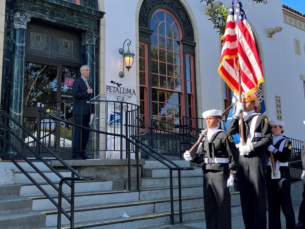 A color guard opens the ceremony at the downtown Petaluma post office in honor of former Congresswoman Lynn Woolsey while Congressman Jared Huffman looks on. The ceremony on Friday, Oct. 14, 2022 marked an official renaming of the post office after Woolsey. (Photo courtesy Mary Hurrell)