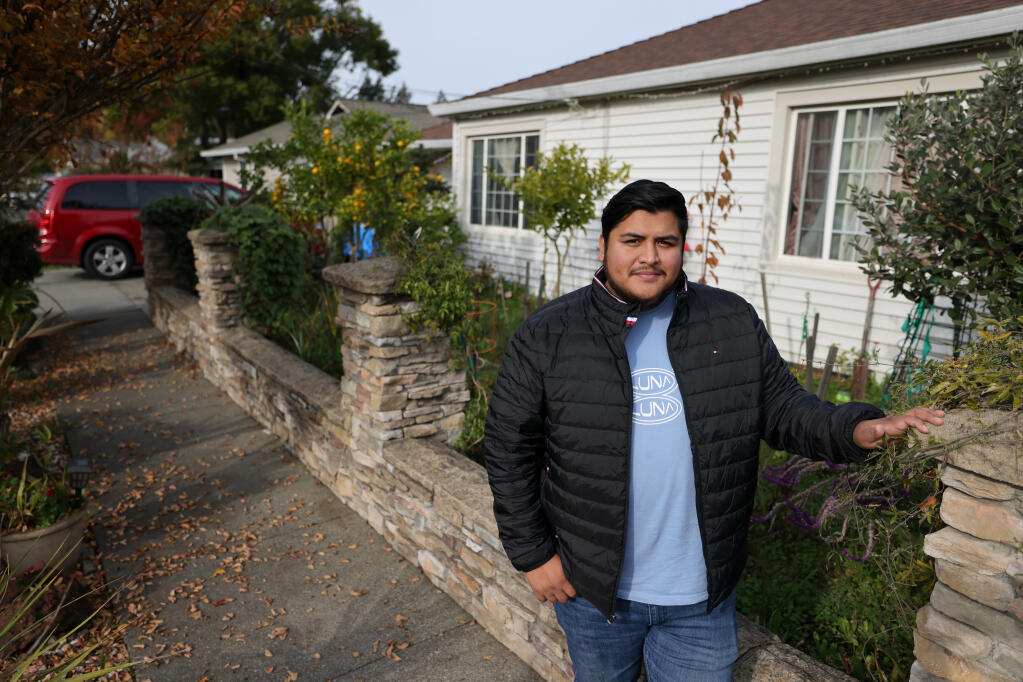 Gilberto Ramirez, the program manager of the Dream Center at Napa Valley College, at his family’s home in Napa , Thursday, Dec. 14, 2023. (Beth Schlanker / The Press Democrat)