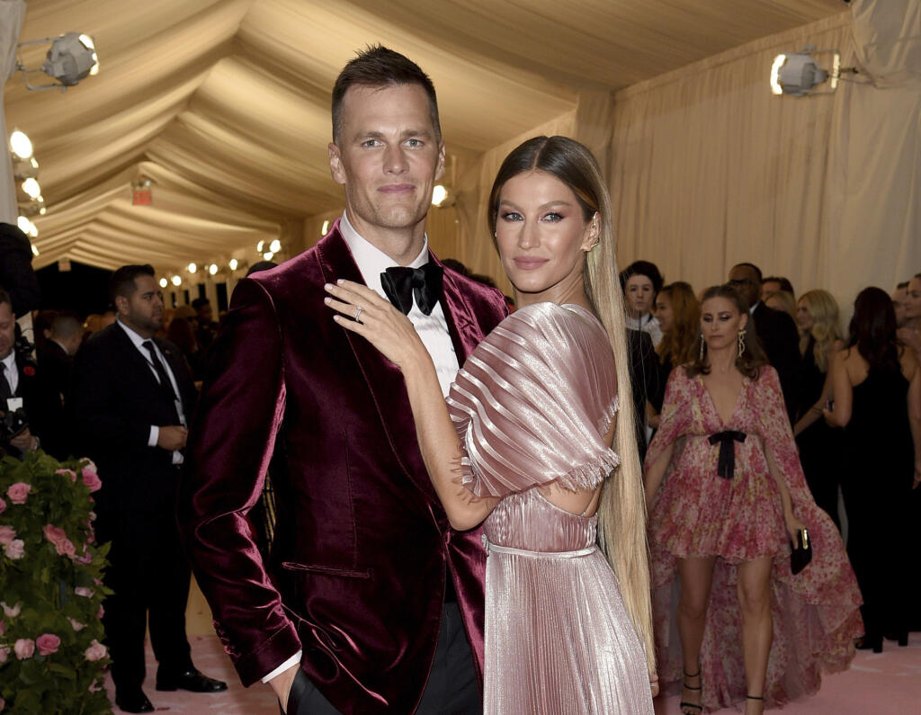 FILE - Tom Brady, left, and Gisele Bundchen attend The Metropolitan Museum of Art's Costume Institute benefit gala on May 6, 2019, in New York. The couple announced Friday they have finalized their divorce, ending their 13-year marriage. (Photo by Evan Agostini/Invision/AP, File)