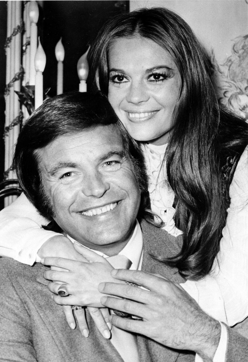 FILE - In this April 23, 1972 file photo, actor Robert Wagner and his former wife, actress Natalie Wood, pose at the Dorchester Hotel in London, England. Investigators are now calling Wagner a 'person of interest' in the 1981 death of his wife Natalie Wood. Mystery has swirled around Wood's death. It was declared an accident but police reopened the case in 2011 to see whether Wagner or anyone else played a role (AP File Photo)