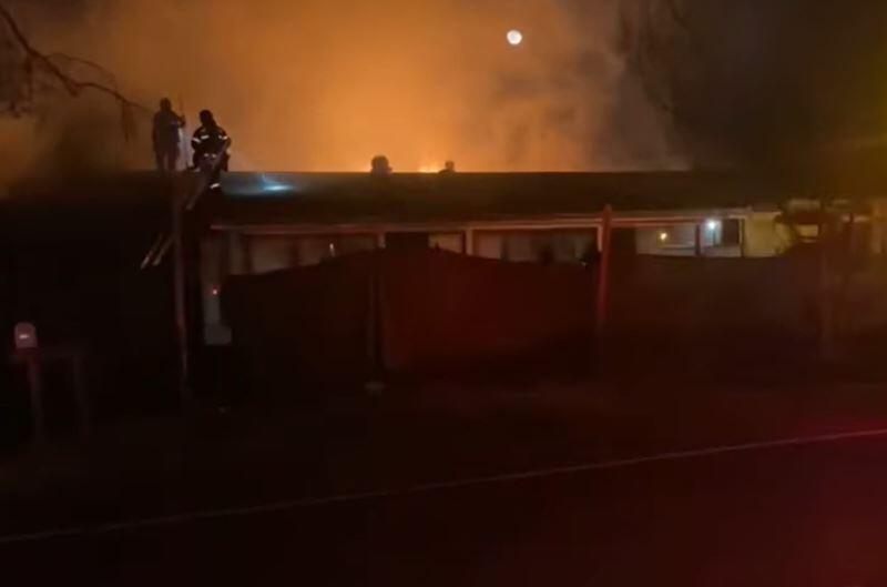 A screenshot from video showing firefighters at the scene of a house fire on Fresno Avenue in Santa Rosa on Sunday, March 20, 2022. (Santa Rosa Fire Department)