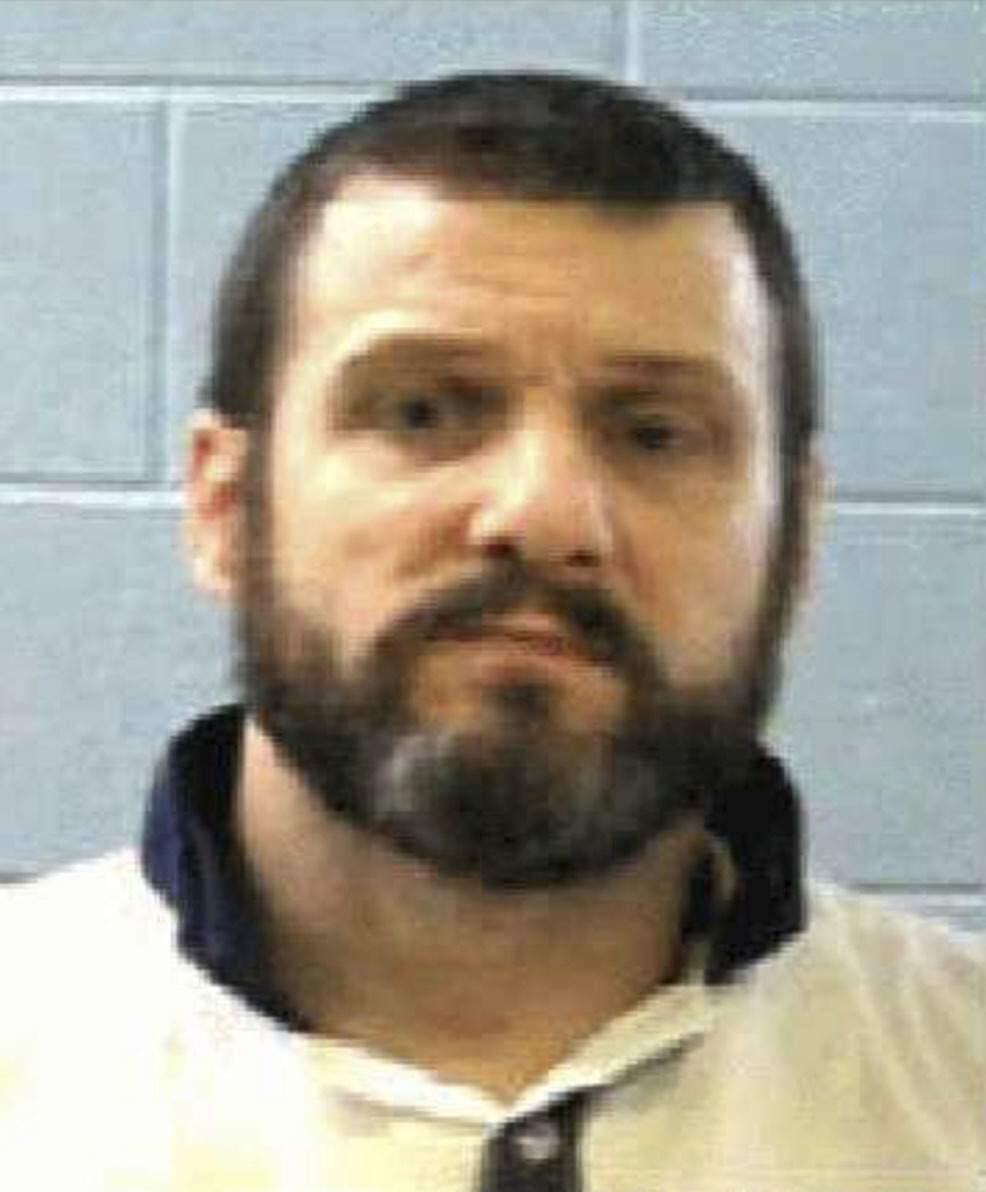 This undated photo released by the Georgia Department of Corrections Tuesday, June 13, 2017, shows inmate Donnie Russell Rowe. Authorities say Rowe and inmate Ricky Dubose escaped after killing two prison guards during a bus transport in Georgia. Both are being sought by law enforcement. (Georgia Department of Law Enforcement via AP)