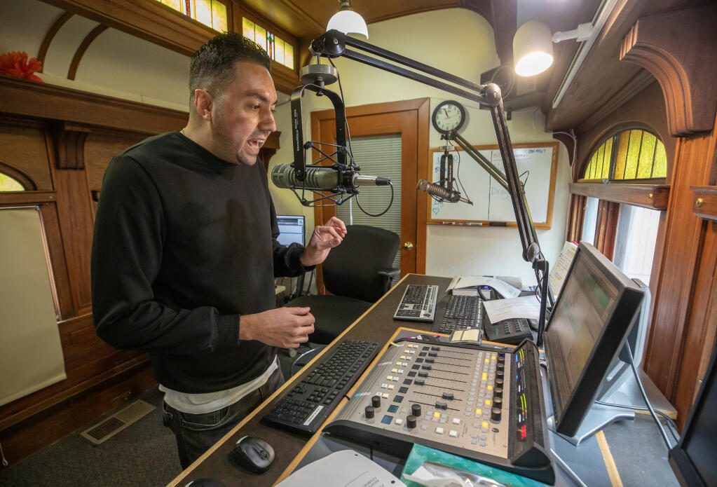 Station director, Eric Madriz works on a promo announcement at the Wine County Radio studios Friday June 23, 2023 in Santa Rosa. Latino 95.5 will change radio station call sign to 100.9, a stronger and farther-reaching signal, on Monday June 26. It will replace modern alternative station The 101. (Chad Surmick / The Press Democrat)