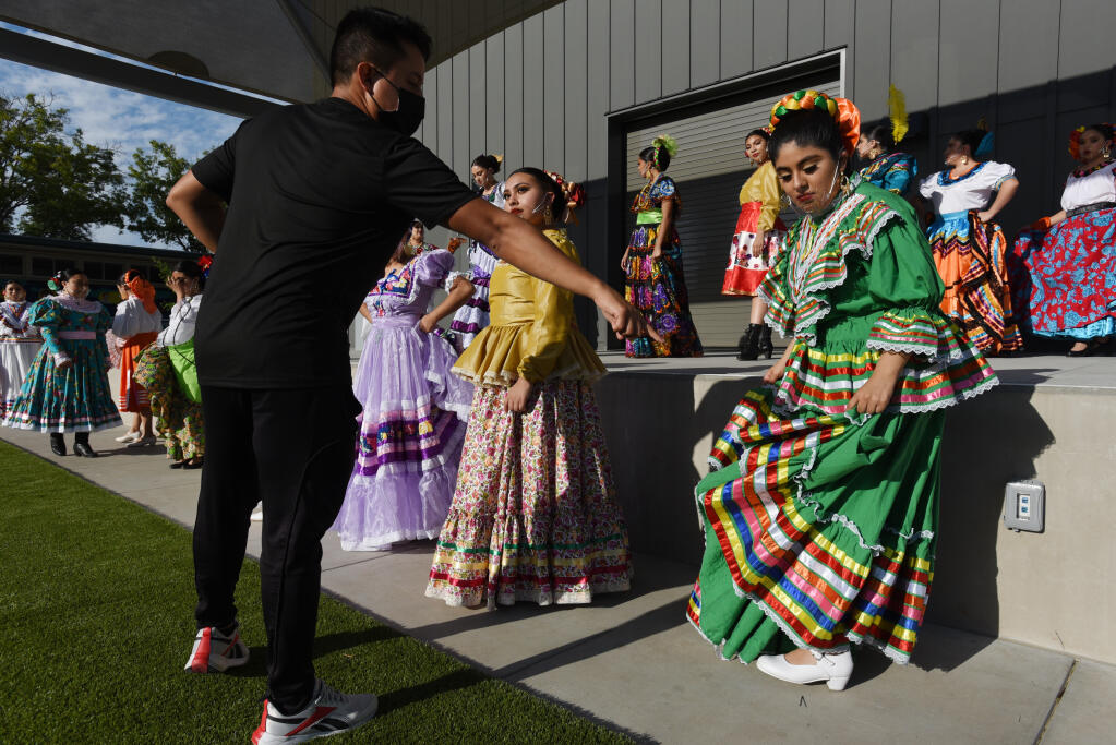 General Director Victor Ferrer working with dancers of Grupo Folklorico Quetzalen of Sonoma Valley during a rehearsal at El Verano Elementary School in Sonoma, Calif. on Friday, May 14, 2021. The group has plans for a live performance on August 14 at Hanna Boys Center in Sonoma, California.(Photo: Erik Castro/for The Press Democrat)