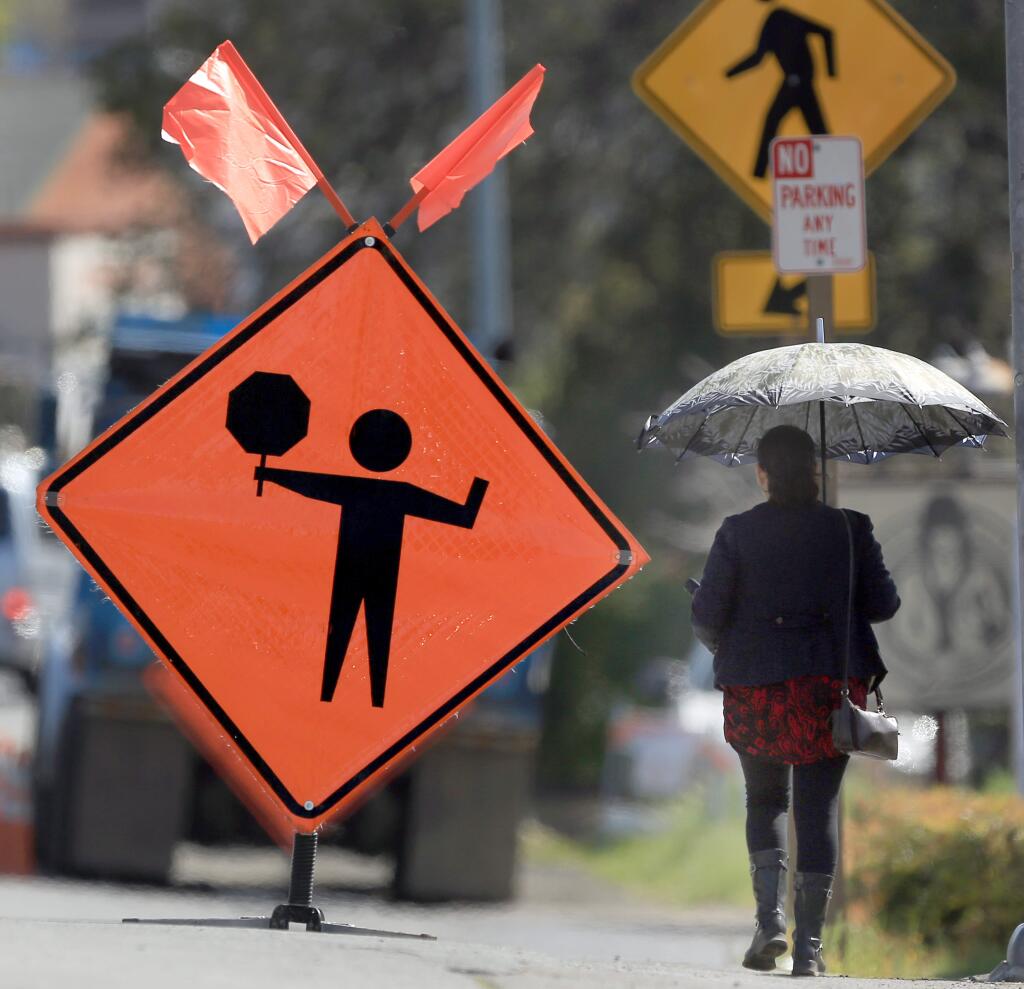 Pedestrians have no sidewalks in Agua Caliente and most walk on the side of the road. A road project in the area will widest the Highway 12 which will include sidewalks. (Kent Porter / Press Democrat) 2015