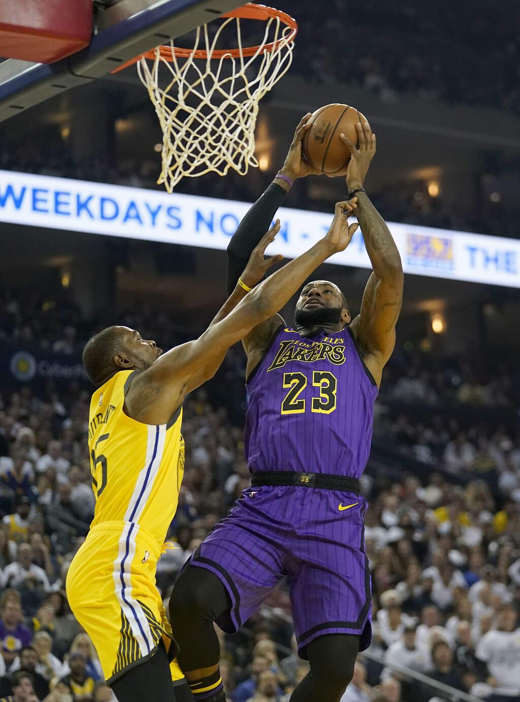 Los Angeles Lakers forward LeBron James (23) shoots over Golden State Warriors forward Kevin Durant (35) during the first half Tuesday, Dec. 25, 2018, in Oakland. (AP Photo/Tony Avelar)