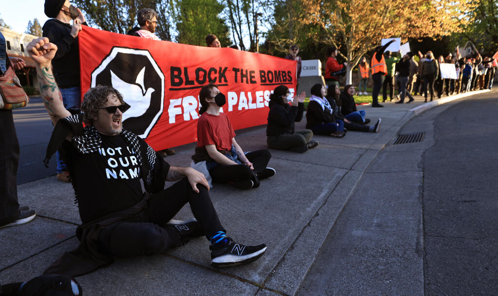Protesters of the Israel-Hamas conflict protest and block entry to General Dynamics Ordnance and Tactical Systems in Healdsburg, Tuesday, April 16, 2024. The company, which is headquartered in Virginia, is the world’s sixth largest defense contractor. (Kent Porter / Press Democrat)