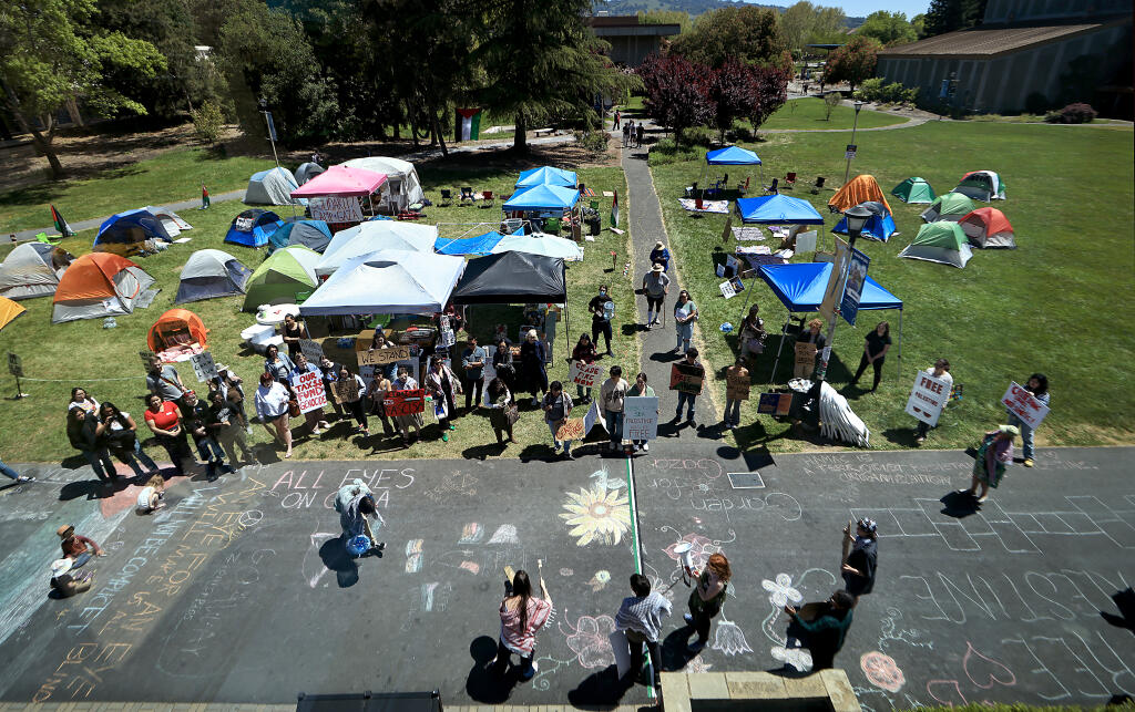 Pro-Palestinian students, community members and  Sonoma State University faculty hold a rally at Person Lawn at SSU, Tuesday, April 30, 2024, in Rohnert Park.  (Kent Porter / The Press Democrat)