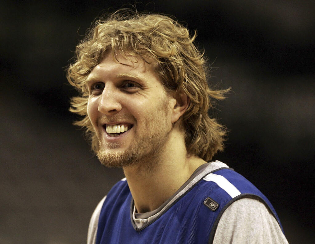 Then-Mavericks player Dirk Nowitzki smiles during a 2006 practice in Dallas.. Nowitzki was announced Friday as being among the finalists for enshrinement in the Basketball Hall of Fame. (LM Otero / ASSOCIATED PRESS)