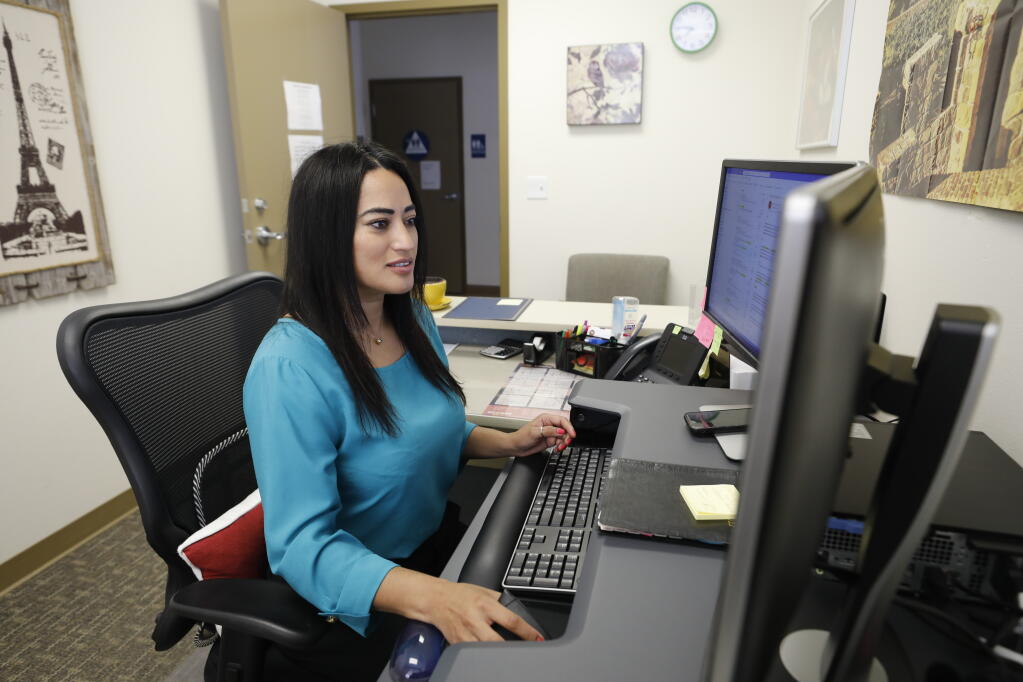 Karina Garcia works as the outreach coordinator for Supervisor Susan Gorin at her office in Sonoma, Calif. on Thursday, July 21, 2022. (Beth Schlanker/The Press Democrat)