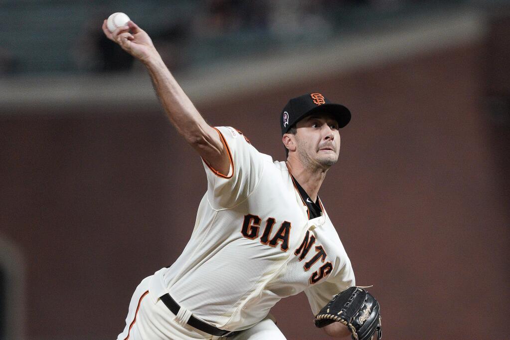 San Francisco Giants pitcher Burch Smith throws to a Pittsburgh Pirates batter during the fifth inning Wednesday, Sept. 11, 2019, in San Francisco. (AP Photo/Tony Avelar)