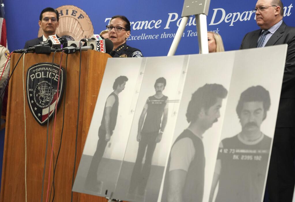 Torrance Police Chief Eve R. Irvine speaks at a press conference in front of a 1972 booking photo of Jake Brown in Torrance on Wednesday, Sep. 11, 2019. Through DNA evidence, the Torrance police department matched a suspect, Jake Brown who is deceased, to the murder of 11-year-old Terri Lynn Hollis in 1972. (Scott Varley/The Orange County Register via AP)