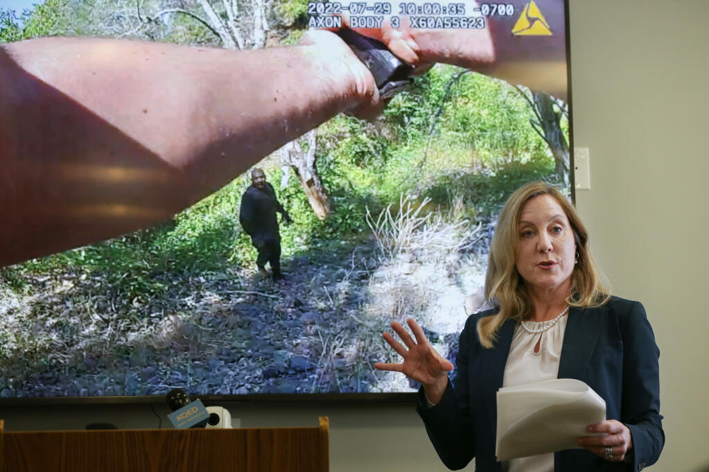 Sonoma County District Attorney Carla Rodriguez addresses the media during a press conference, while showing a slide of body camera footage of Sonoma County Sheriff’s Deputy Michael Dietrick with his weapon trained on David Pelaez-Chavez, in Santa Rosa. Tuesday, Nov.  7, 2023. Rodriguez announced the DA’s office would not be charging Dietrick in the 2022 shooting of Pelaez-Chavez. (Christopher Chung / The Press Democrat)