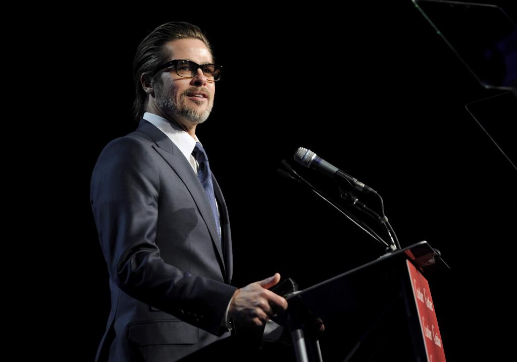 Brad Pitt presents the breakthrough performance award - actor at the 26th annual Palm Springs International Film Festival Awards Gala on Saturday, Jan. 3, 2015, in Palm Springs, Calif. (Photo by Chris Pizzello/Invision/AP)