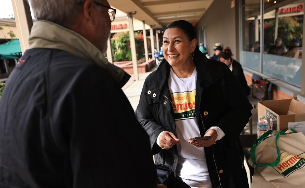 Rebecca Hermosillo, candidate for District 1, Sonoma County Board of Supervisors, talks with Glenn Smith from Santa Rosa as he prepares to canvas for Hermosillo in the Bennet Valley area, Saturday, March 2, 2024. (Kent Porter / Press Democrat) 2024