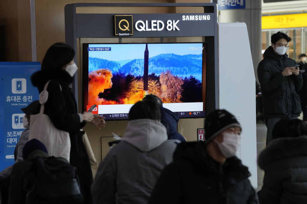 People watch a TV showing an image of North Korea's missile launch during a news program at the Seoul Railway Station in Seoul, South Korea, Monday, Jan. 31, 2022. North Korea confirmed Monday it test-launched an intermediate-range ballistic missile capable of reaching the U.S. territory of Guam, the North's most significant weapon launch in years, as Washington plans to respond to demonstrate it's committed to its allies' security in the region. (AP Photo/Ahn Young-joon)