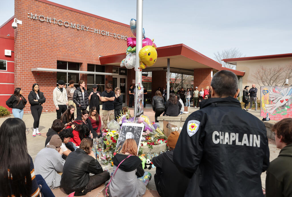 Students gather to mourn Jayden Pienta at a memorial site at Montgomery High School in Santa Rosa, Friday, March 3, 2023.  (Christopher Chung / The Press Democrat file)