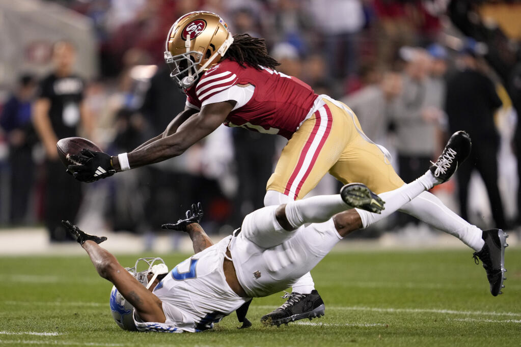 49ers wide receiver Brandon Aiyuk, top, catches a pass against Detroit Lions cornerback Kindle Vildor during the second half of the Jan. 28 NFC championship game in Santa Clara. (Godofredo A. Vasquez / ASSOCIATED PRESS)